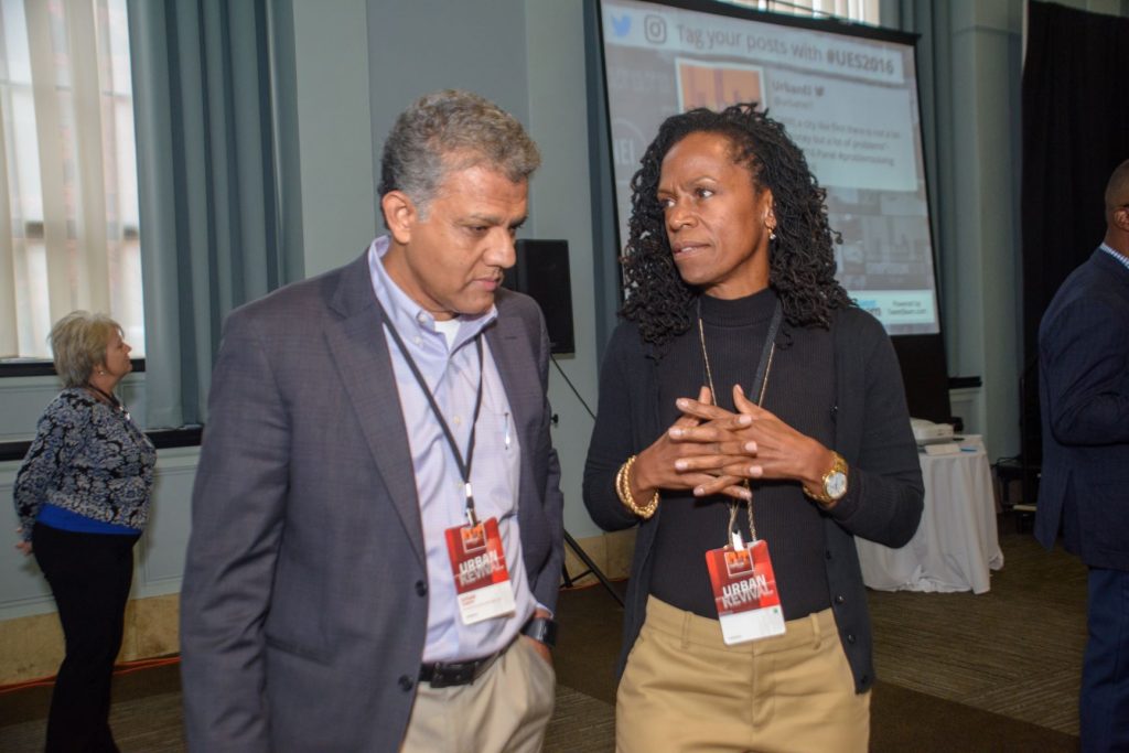 attendees confer at urban entrepreneurship initiative 2016 symposium in Flint Michigan.