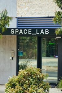 A building with a sign that says space lab